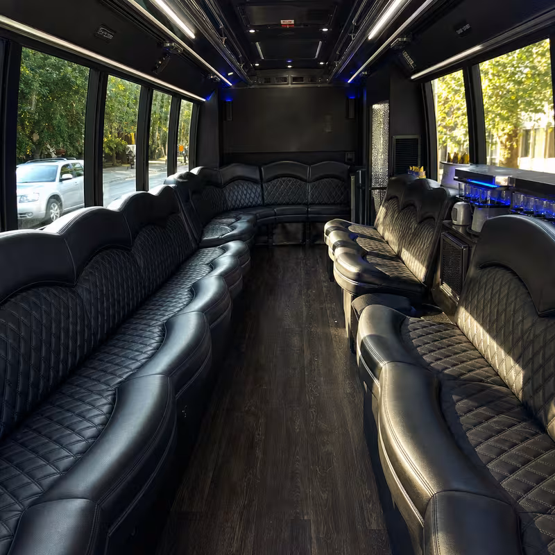 Friends laughing during a New Orleans party bus celebration