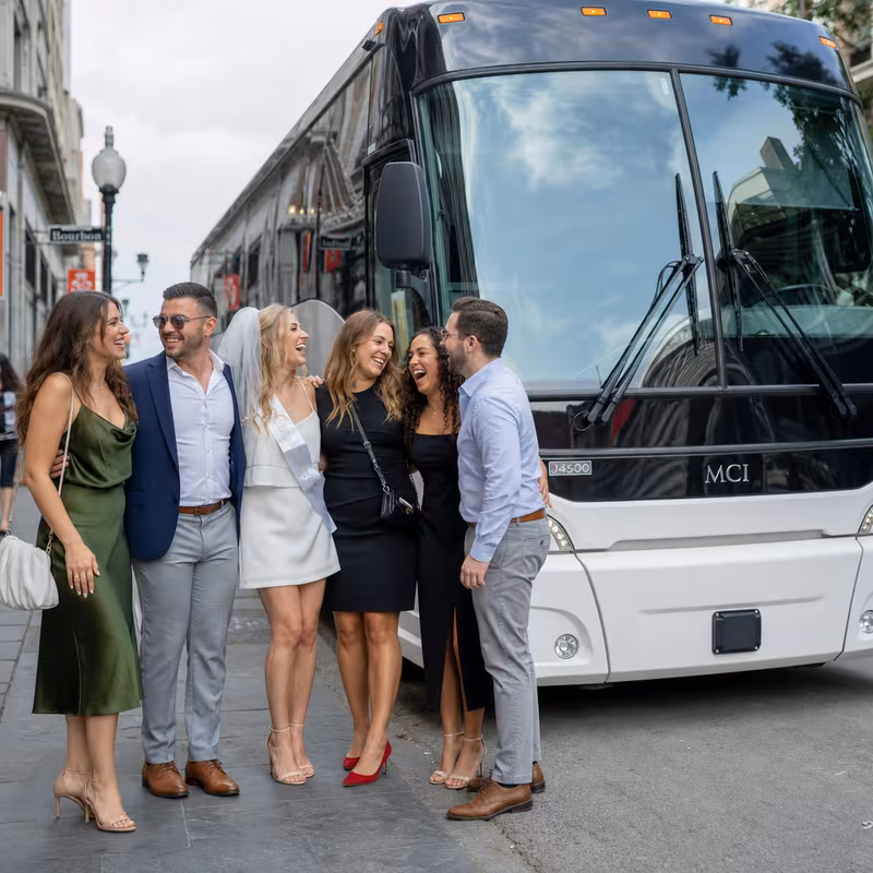 Passengers loading luggage while boarding an New Orleans group shuttle