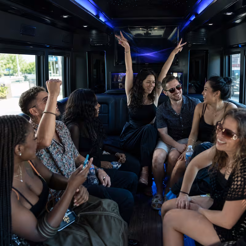 Passengers loading luggage while boarding an New Orleans group shuttle