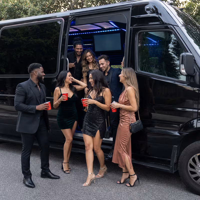 Passengers loading luggage while boarding an New Orleans group shuttle