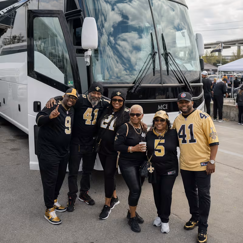 Passengers loading luggage while boarding an New Orleans group shuttle