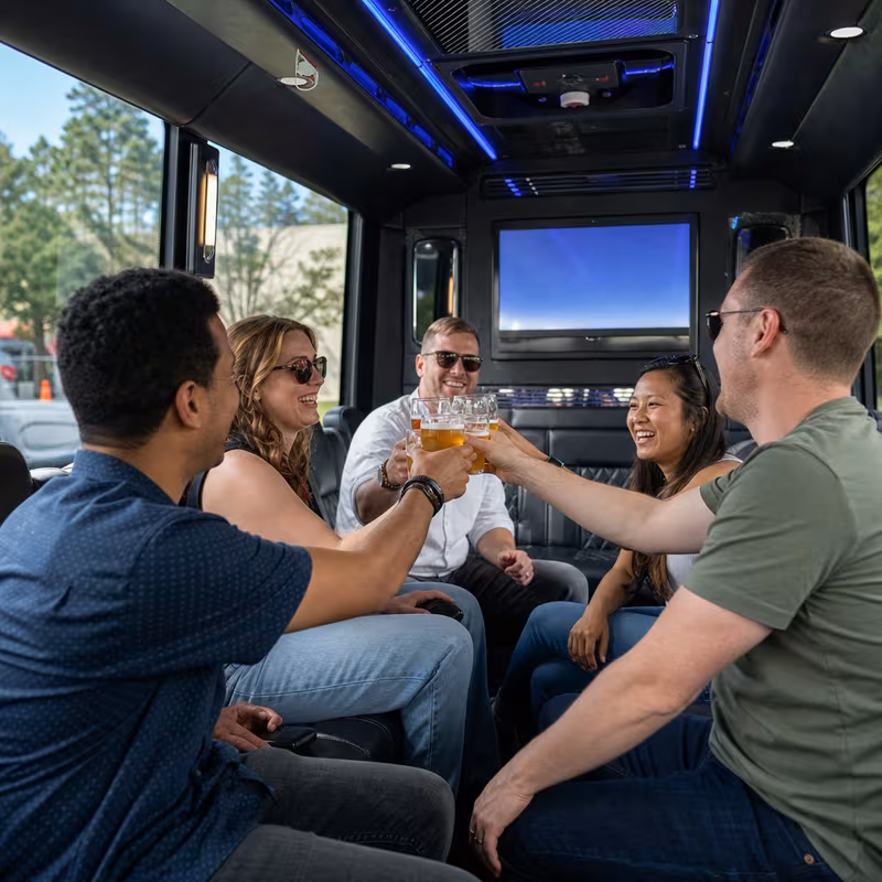 Group boarding a white charter bus for Winery & Brewery Tour Transportation transportation in New Orleans