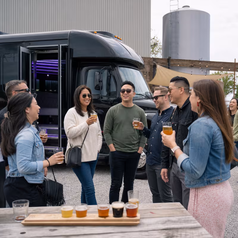 Passengers loading luggage while boarding an New Orleans group shuttle